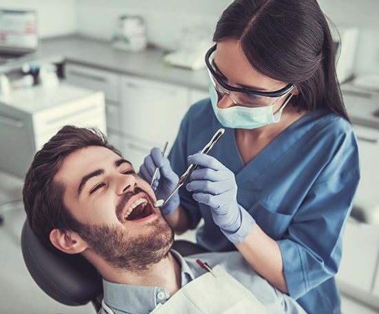 Dentist checking patient before partial and denture treatment