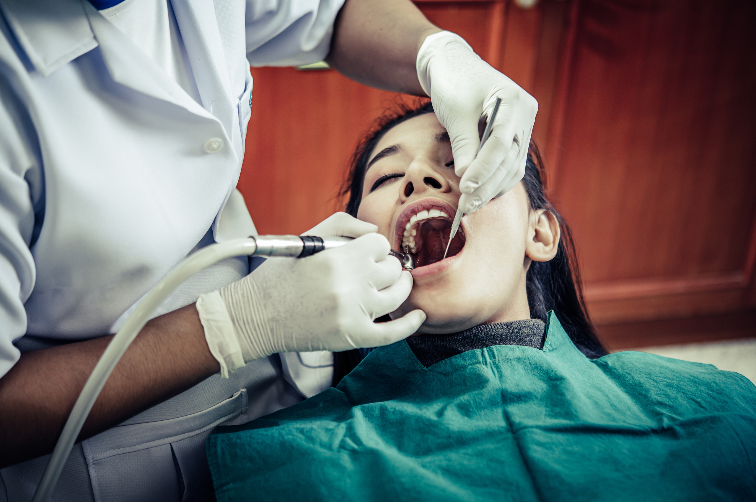Do root canals hurt? Image of a dentist performing root canal treatment on a patient